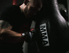 BUSHIDO INSTRUMENTAL TRAINING GLOVES ON A BAG